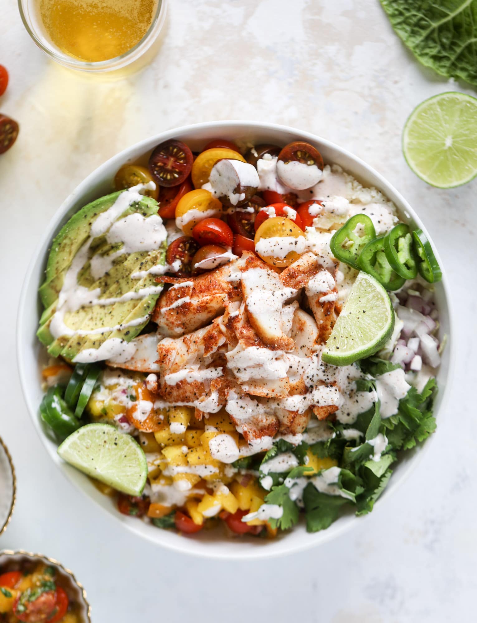 SPICY FISH TACO BOWLS WITH MANGO PICO.